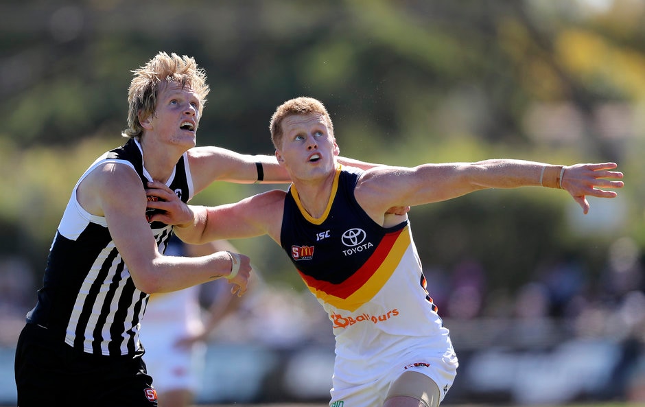 SANFL 2018 Round 01 - Port Adelaide v Adelaide ADELAIDE, AUSTRALIA - MARCH 31: Sam Hayes of the Magpies clashes with Reilly O'Brien of the Crows during the 2018 SANFL round 01 match between the Port Adelaide Magpies and Adelaide at Alberton Oval on March 31, 2018 in Adelaide, Australia. (Photo by AFL Media)